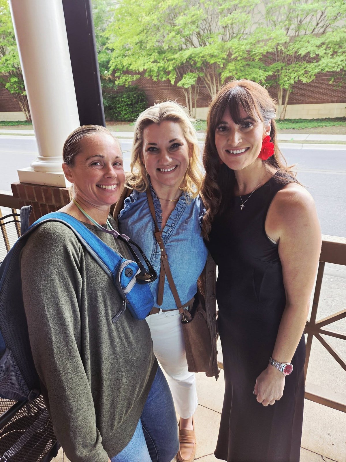 Erin Holt with two colleagues at the Top Agent recognition event