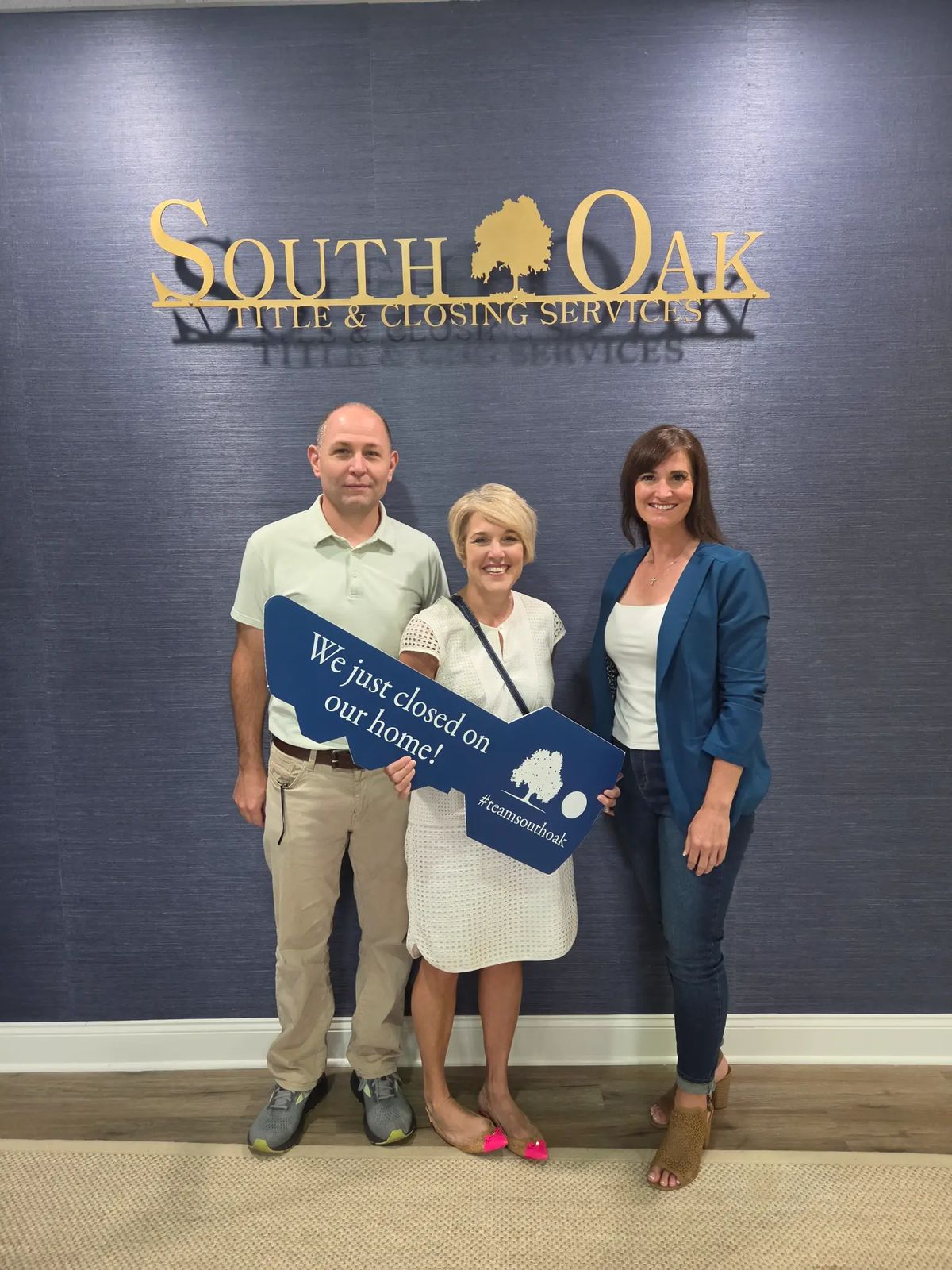 The McEacharn family with Erin Holt at their South Oak Title closing